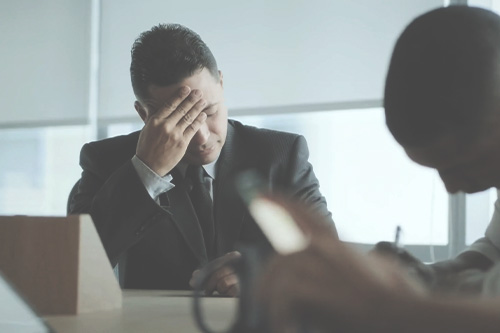 employee suffering through a meeting that sucks