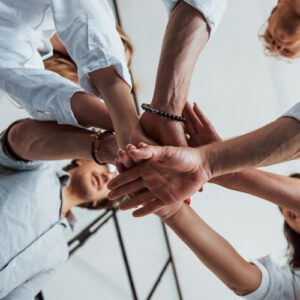 business team with hands in center