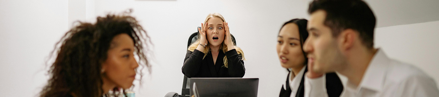 group of employees arguing going through conflict